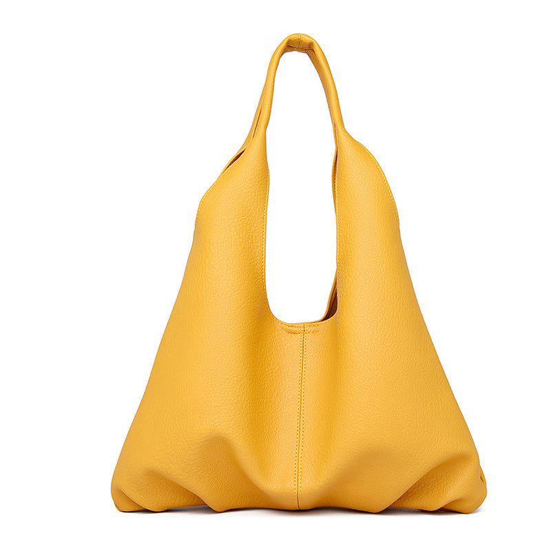 Yellow underarm shoulder bag on a white background