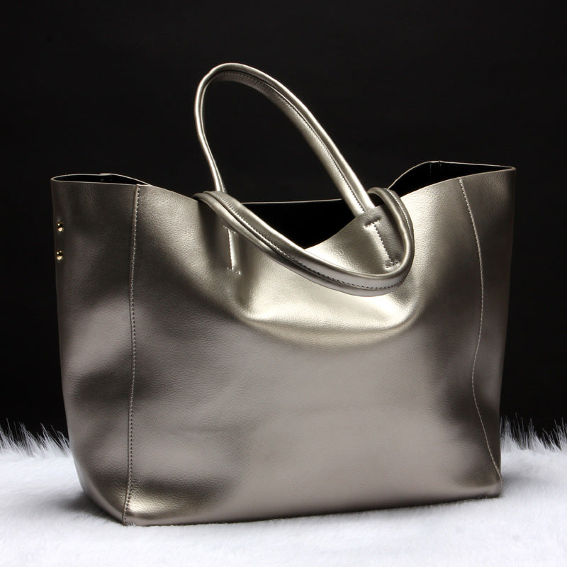 Silver handbag on a black background