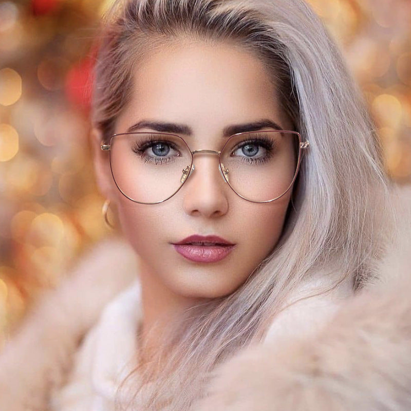Woman wearing glasses with a blurred, warm-toned background