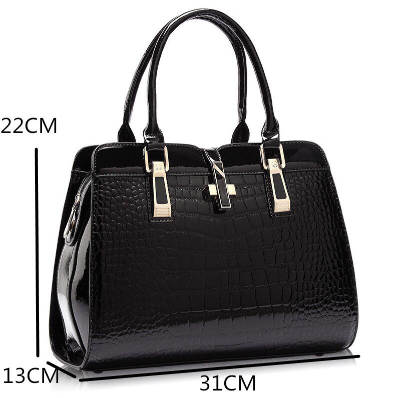 Black crocodile pattern handbag with gold accents and measurements