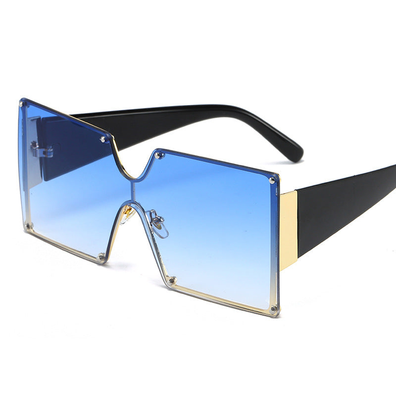 Sunglasses with blue gradient lenses and black frame on a white background