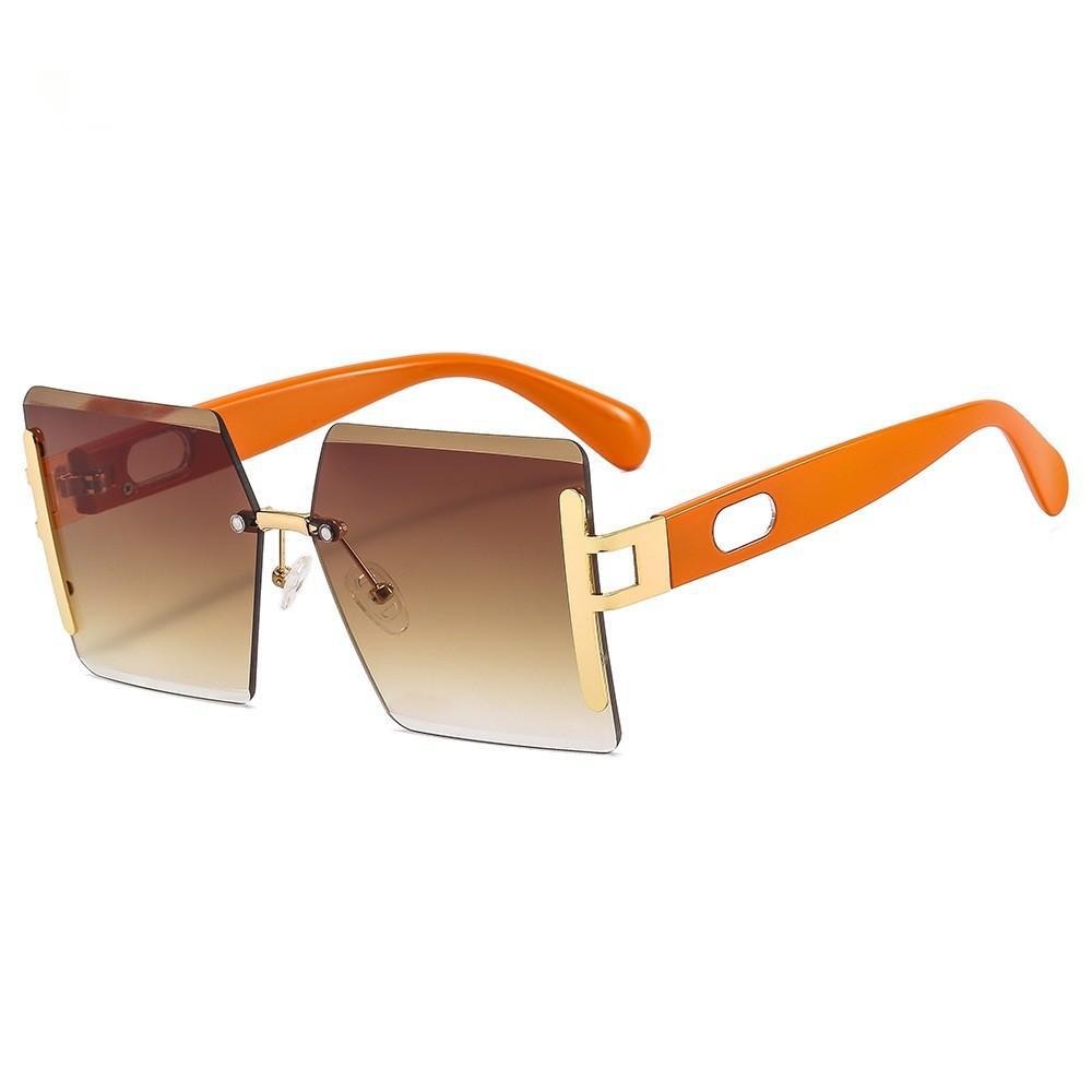 Sunglasses with orange frame and gradient lenses on a white background