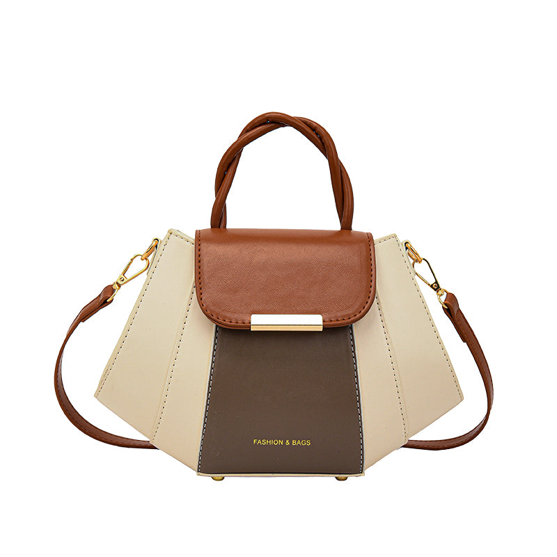 Multicolored women's handbag on a white background