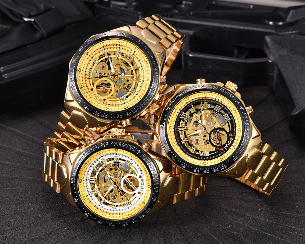 Three gold mens mechanical watches with intricate designs on a dark surface