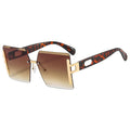 Sunglasses with tortoiseshell frame and gradient lenses on a white background