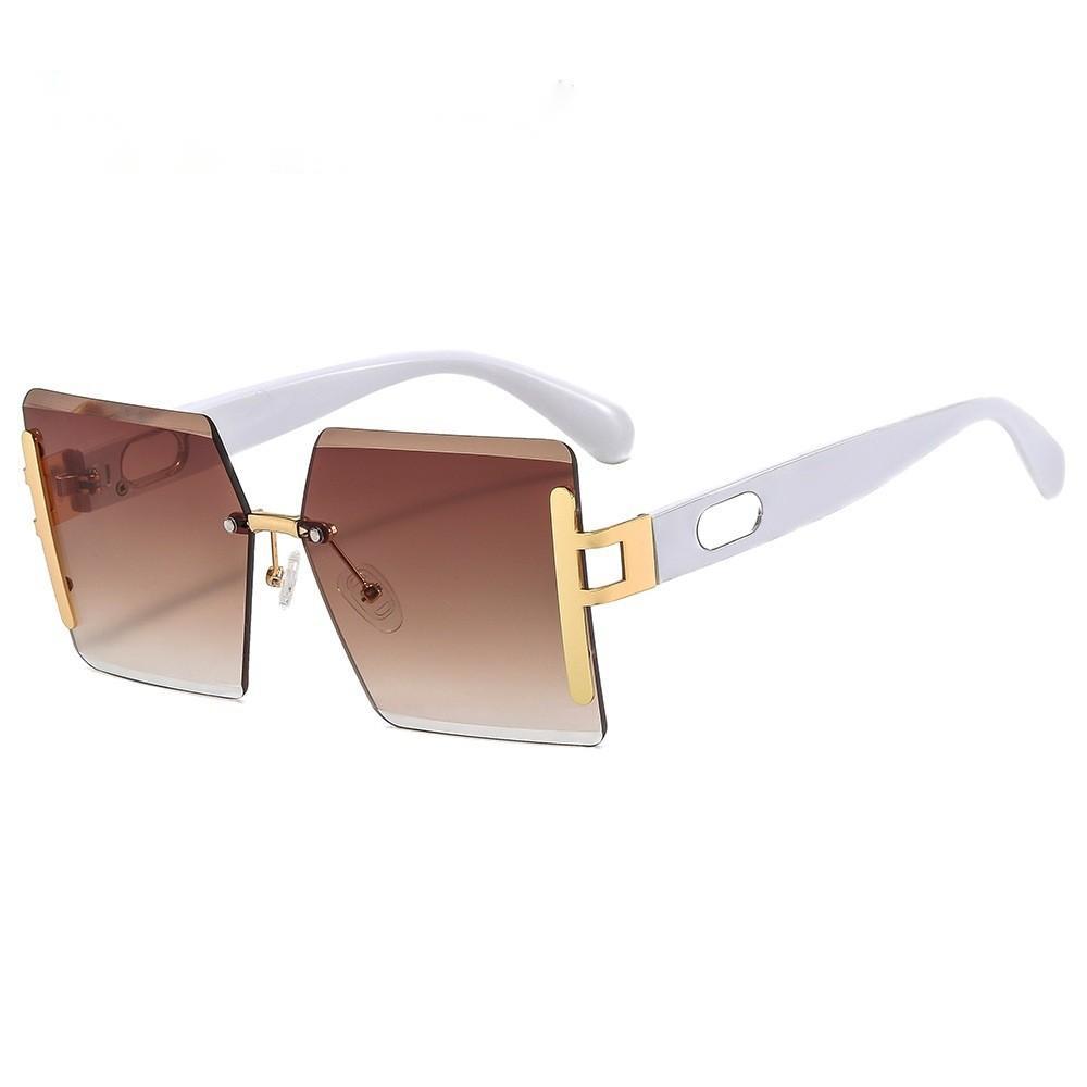 Sunglasses with gold and white frame on a white background
