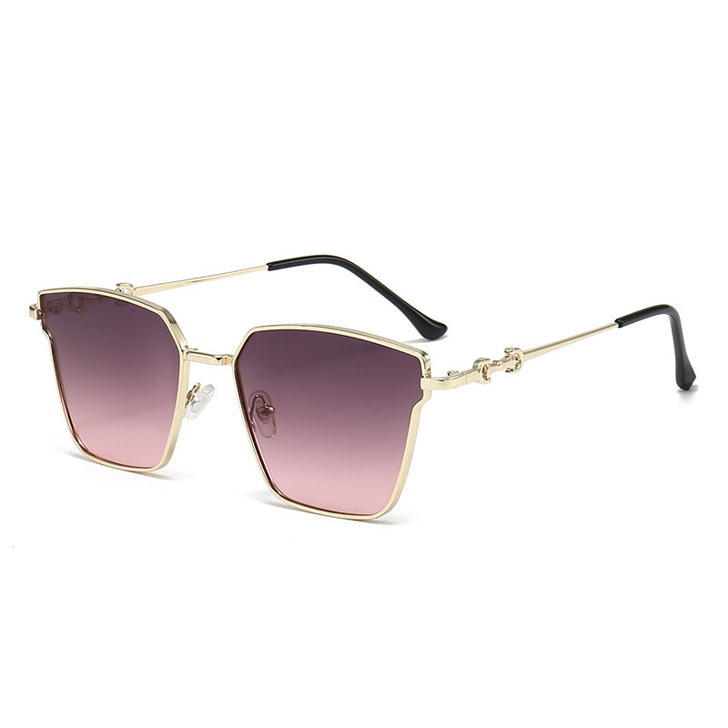 Sunglasses with gold frame and gradient purple lenses on a white background