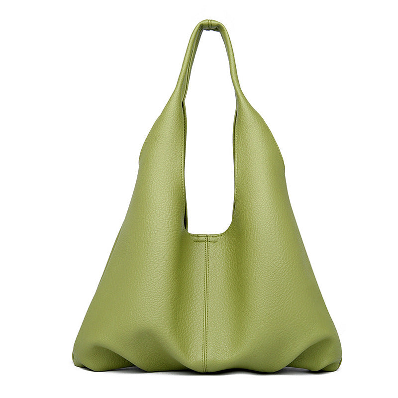 Green underarm shoulder bag on a white background