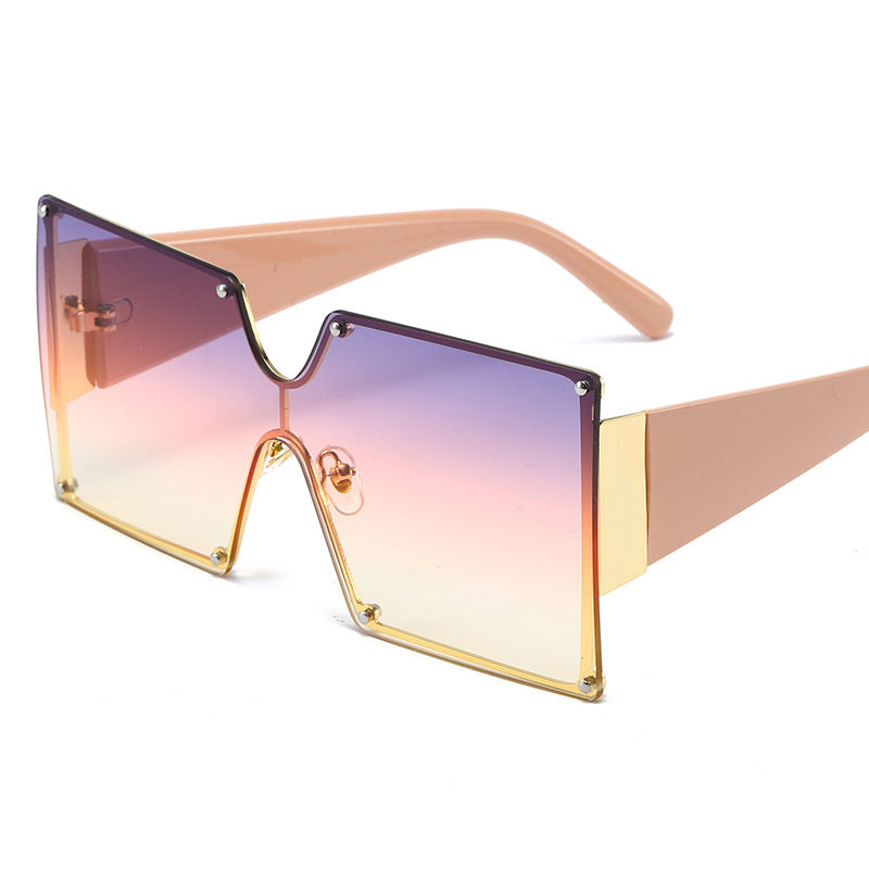 Sunglasses with gradient purple and pink lenses on a white background