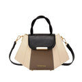 Two-tone women's handbag with black and beige design on a white background