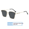 Sunglasses with gold frame and black and gray film on a white background