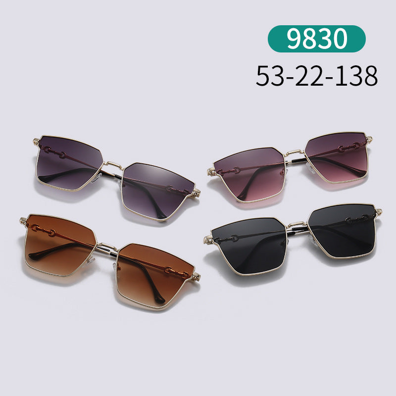 Set of sunglasses with gradient lenses on a light gray background