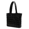 Black quilted women's plaid shoulder bag on a white background