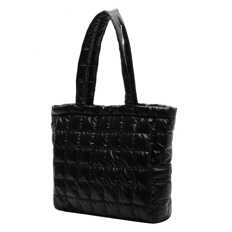Black quilted women's plaid shoulder bag on a white background