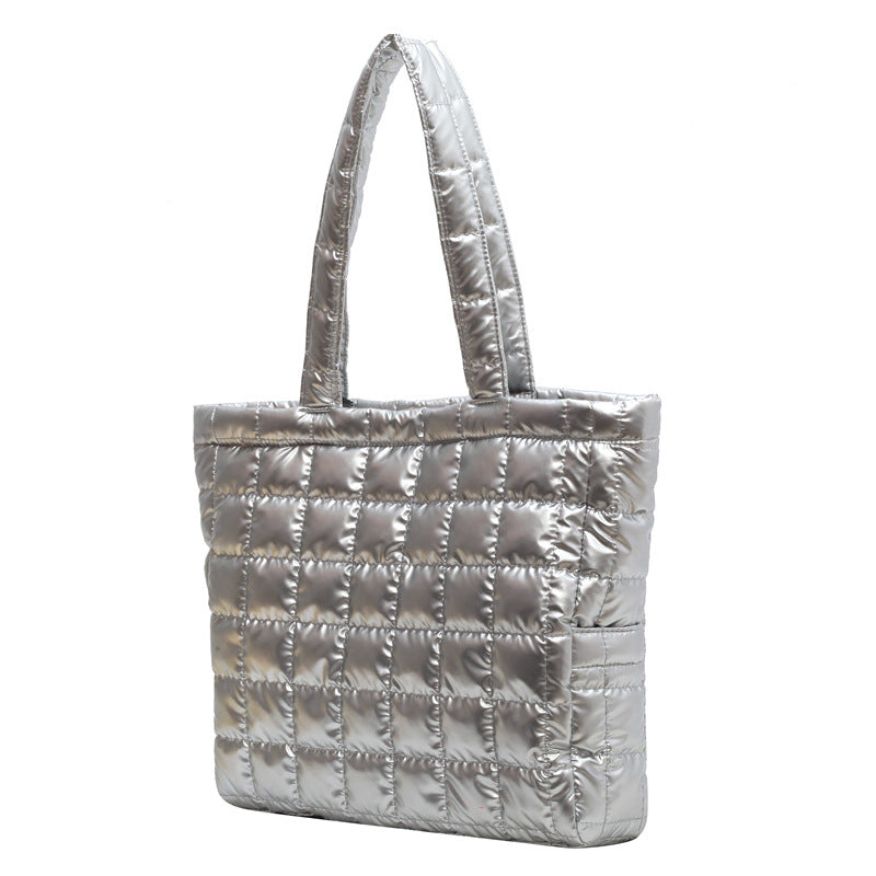 Silver quilted women's plaid shoulder bag on a white background