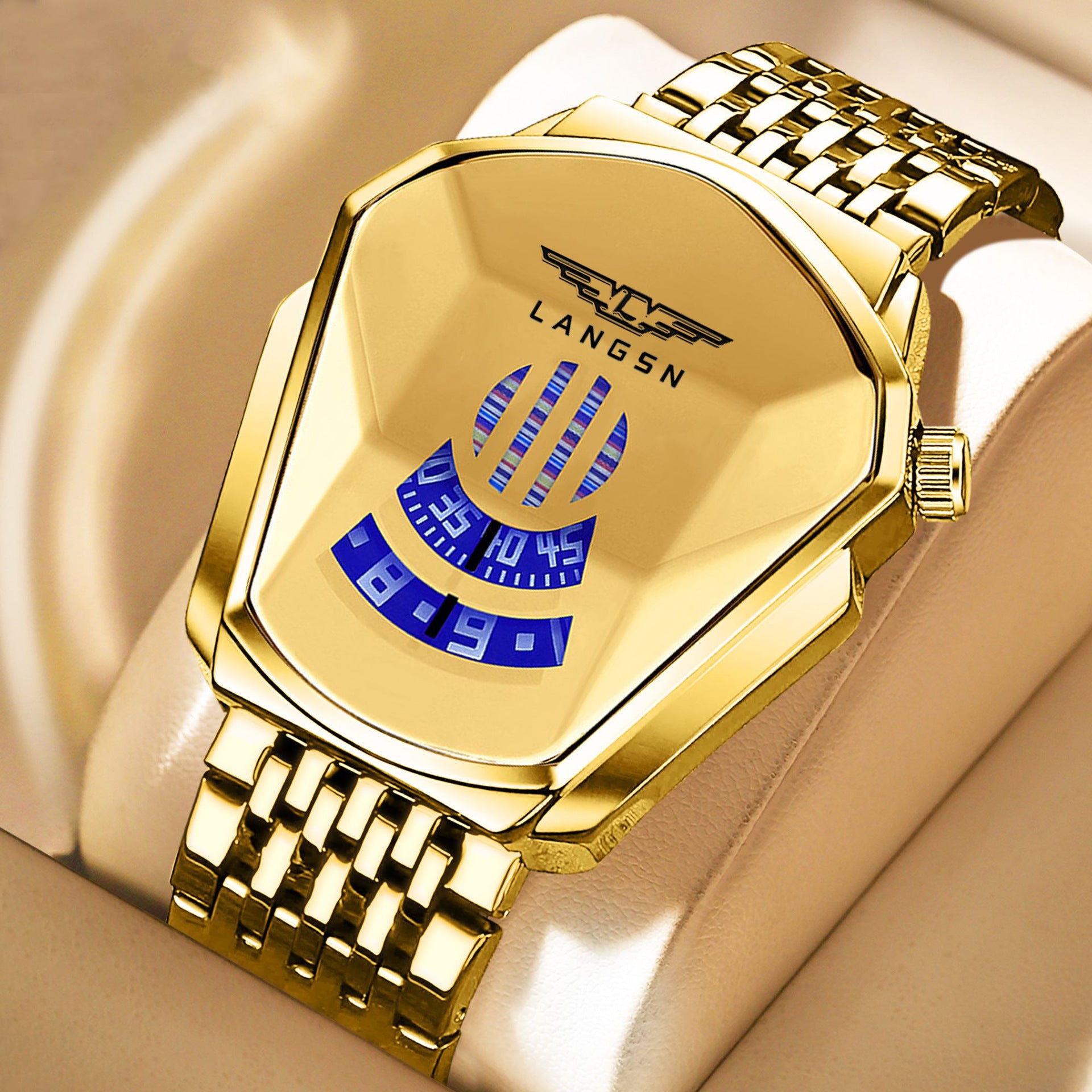 Gold mens watch with blue face on a beige background