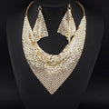 Gold mesh scarf necklace on a black mannequin