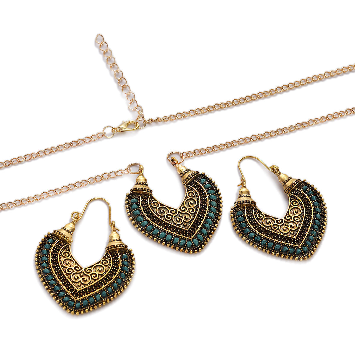Jewelry set with gold and black heart-shapedd earrings and a necklace