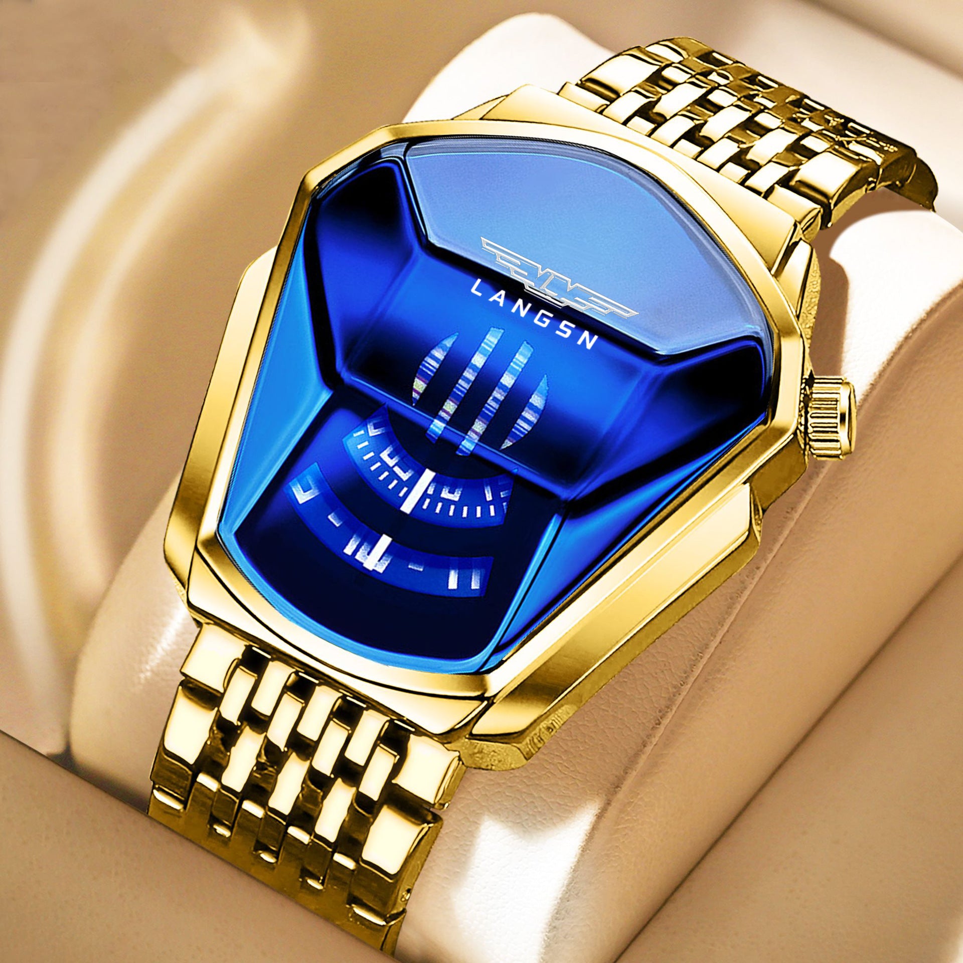 Luxury gold mens watch with blue face on a beige background