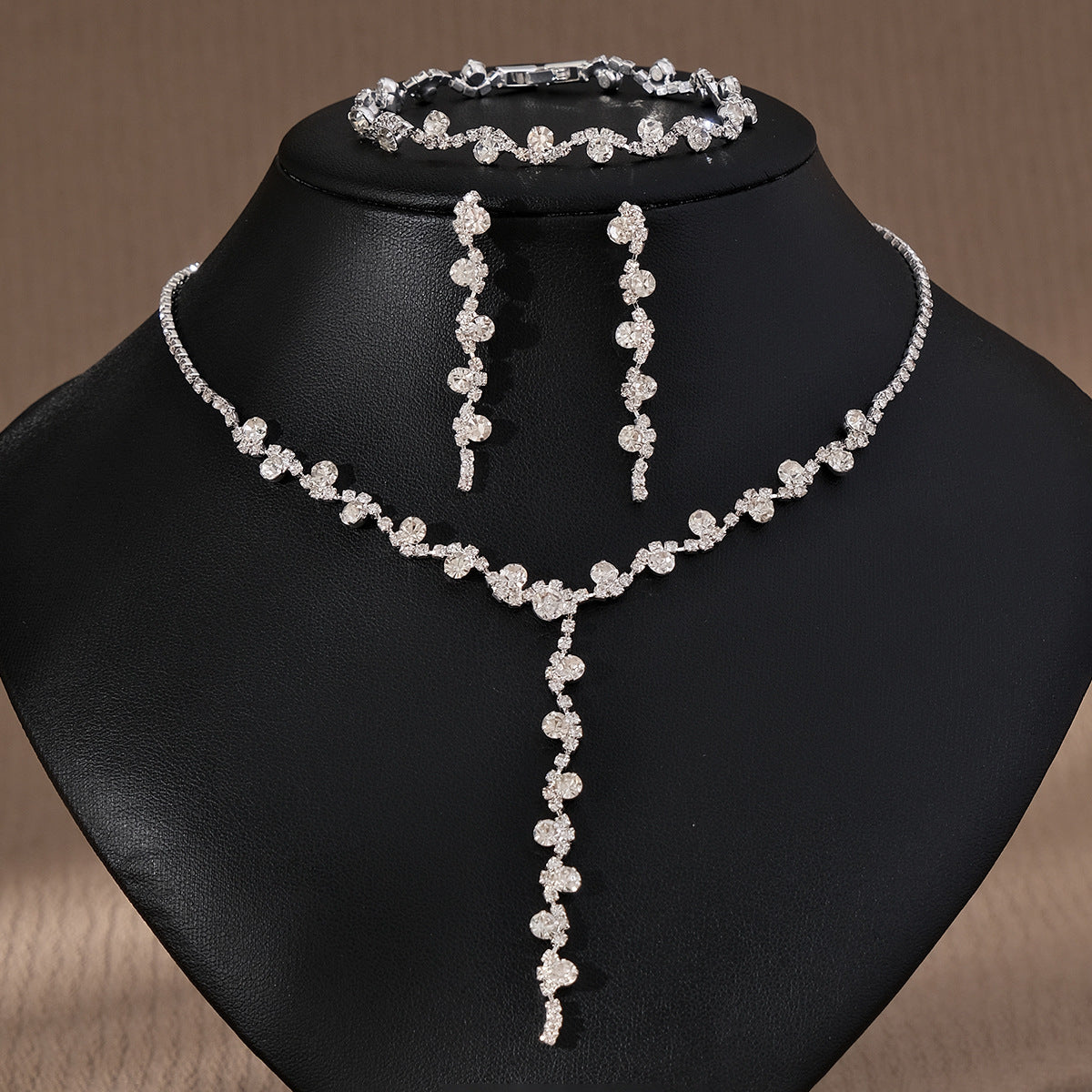 Jewelry set including pearl necklace, earrings, and bracelet