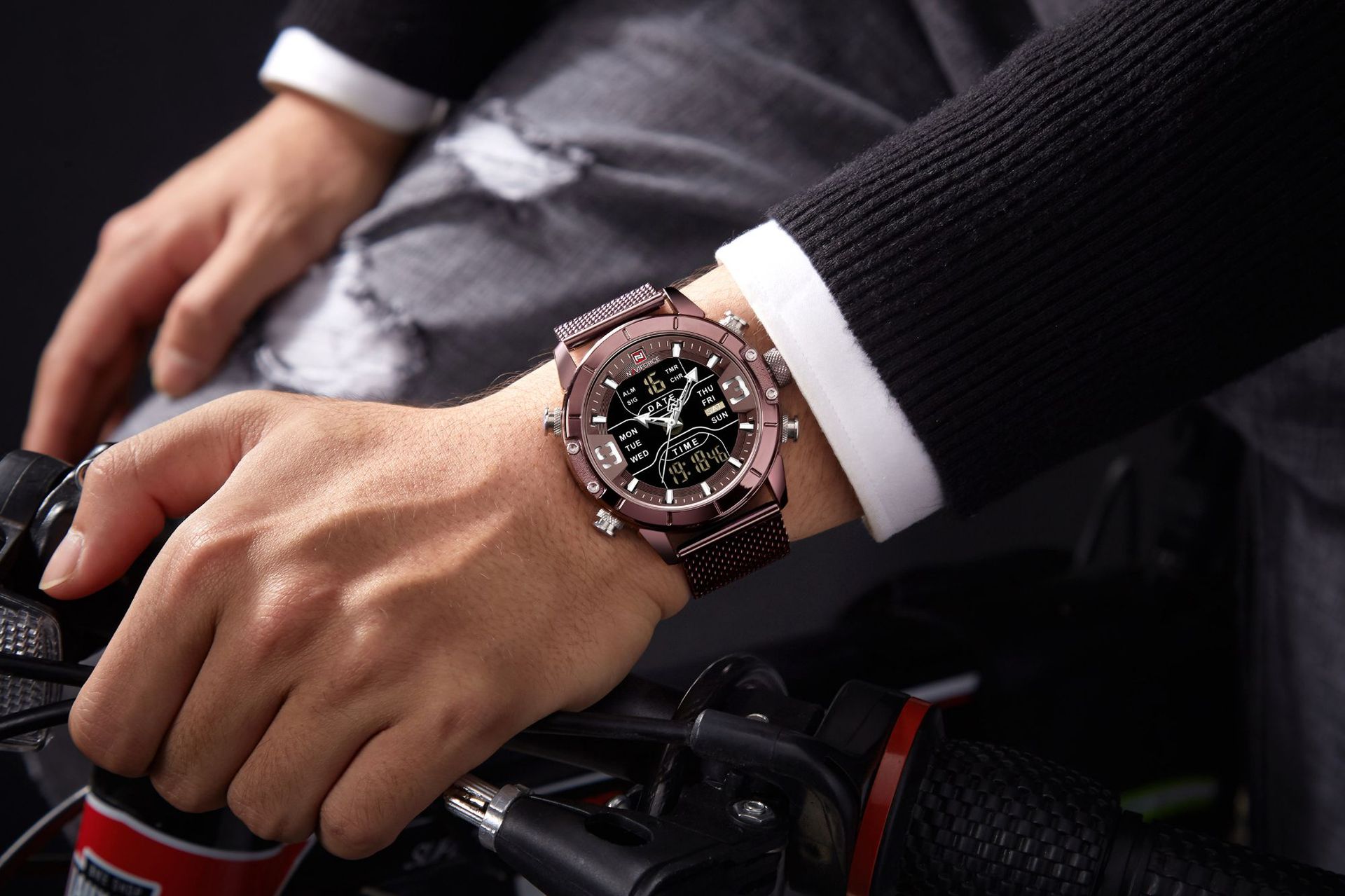 Person wearing a rose gold mens sport watch