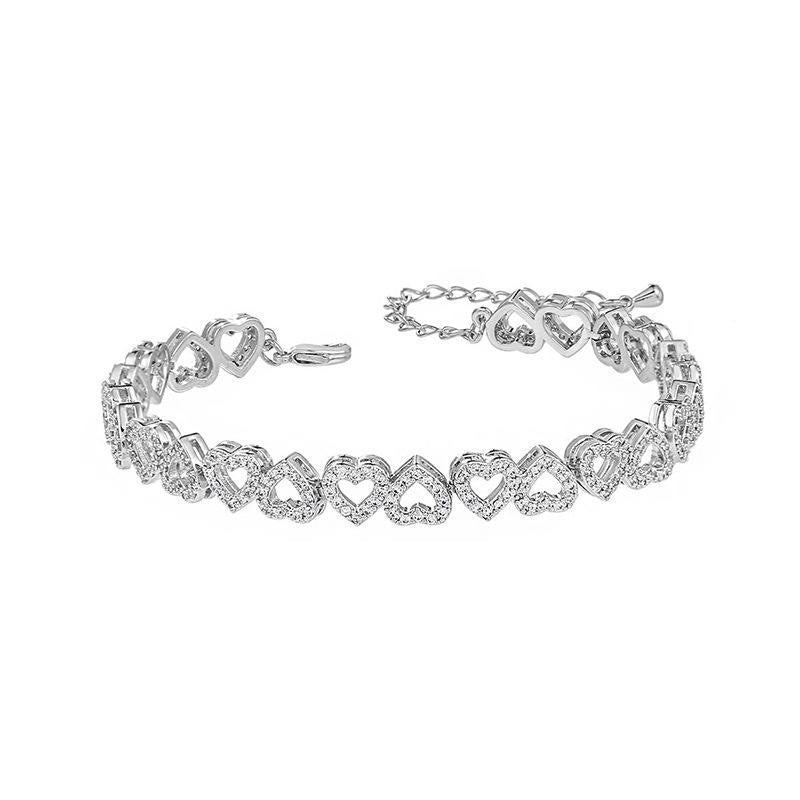 Silver heart bracelet on a white background