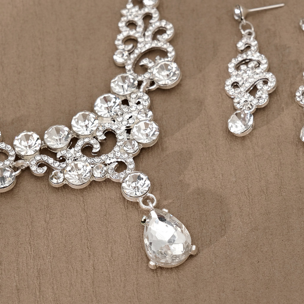 Silver pearl necklace and earrings with clear gemstones