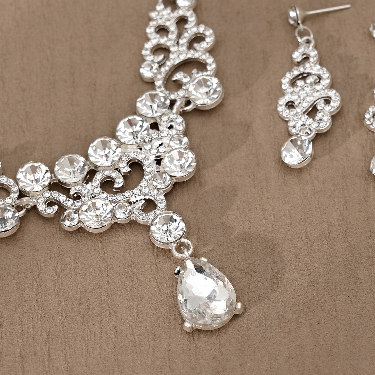Silver pearl necklace and earrings with clear gemstones